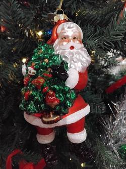 Santa decoration holding tree